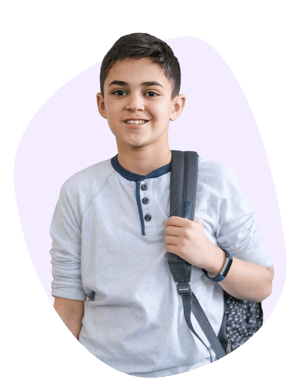 A boy at a desk with his homework